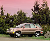 AUT 15 RK0148 01
1999 Lexus RX300 Bronze 3/4 Front View On Grass By Trees Filtered