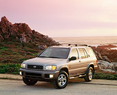 AUT 15 RK0197 05
1999 1/2 Nissan Pathfinder Limited Gray 3/4 Front View On Pavement By Ocean And Rocks Filtered
