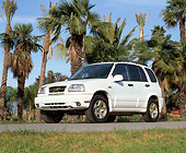 AUT 15 RK0301 16
2000 Suzuki Grand Vitara White Low 3/4 Front View On Pavement By Palm Trees