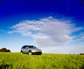 AUT 15 RK0330 07
2000 BMW X5 Silver Distant Shot 3/4 Front View On Grass Cloudy Blue Sky