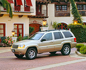 AUT 15 RK0377 03
2000 Jeep Grand Cherokee Limited Champagne 3/4 Side View By Spanish Building