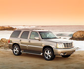 AUT 15 RK0596 07
2002 Cadillac Escalade Canepa Design LE Pewter 3/4 Front View On Beach Filtered