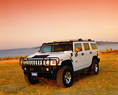 AUT 15 RK0737 05
2003 H2 Hummer White 3/4 Front View On Dry Grass By Water Filtered