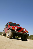 AUT 15 RK0847 01
2004 Jeep Wrangler Red 3/4 Front Low View On Road