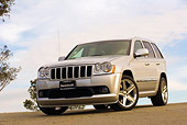 AUT 15 RK0934 01
2006 Jeep Grande Cherokee SRT8 Silver Low 3/4 Front View On Pavement