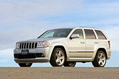 AUT 15 RK0935 01
2006 Jeep Grande Cherokee SRT8 Silver Low 3/4 Side View On Pavement