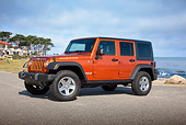 AUT 15 RK1225 01
2011 Jeep Wrangler Rubicon Orange 3/4 Front View On Beach