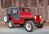 AUT 15 RK1234 01
1947 Jeep CJ-2A Red With Black Top 3/4 Front View On Gravel By Wooden Shed