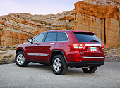 AUT 15 RK1249 01
2012 Jeep Grand Cherokee Limited 4X4 Red 3/4 Rear View On Pavement