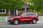AUT 15 RK1255 01
2012 Jeep Grand Cherokee Limited 4X4 Red Profile View On Pavement By House