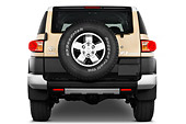 AUT 15 IZ0074 01
2013 Toyota FJ Cruiser Yellow Rear View Studio