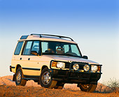 AUT 15 RK0016 02
1996 Land Rover Discovery White Front 3/4 View On Dirt Hill Blue Sky