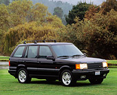 AUT 15 RK0023 02
1996 Land Rover Range Rover Turbo Black 3/4 Front View On Grass Trees Background