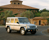 AUT 15 RK0039 02
1997 Mercedes-Benz Gelaendewagen Silver 3/4 Front View On Pavement By House