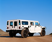 AUT 15 RK0049 02
1996 Hummer H1 White 3/4 Rear View On Dirt Road Blue Sky