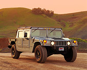 AUT 15 RK0067 01
1996 Hummer H1 Convertible Pick-up Gray 3/4 Front View On Dirt Grass Hills