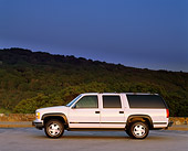 AUT 15 RK0084 03
1999 GMC Suburban SLT White Profile View On Pavement