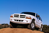 AUT 15 RK0100 01
1999 Dodge Durango SLT White Low 3/4 Front View On Dirt Hill Blue Sky