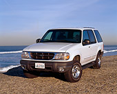 AUT 15 RK0155 03
1999 Ford Explorer White Front 3/4 View On Gravel By Ocean