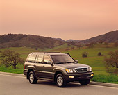 AUT 15 RK0170 05
1999 Lexus LX470 Green 3/4 Front View On Pavement By Grass Hills Filtered