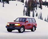 AUT 15 RK0207 06
1995 Toyota Land Cruiser Burgundy 3/4 Front View On Snow Trees