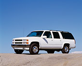 AUT 15 RK0246 04
1995 Chevrolet Canepa Suburban White 3/4 Side View On Pavement Hill Blue Sky