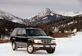 AUT 15 RK0270 02
1996 Ford Explorer Black Front 3/4 View On Snow By Mountains