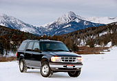 AUT 15 RK0270 04
1996 Ford Explorer Black Front 3/4 View On Snow By Mountains