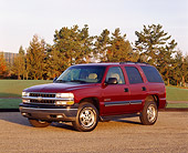 AUT 15 RK0274 08
2000 Chevrolet Tahoe Burgundy 3/4 Front View On Pavement By Grass And Trees