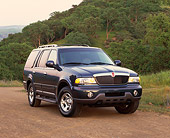 AUT 15 RK0305 02
2000 Lincoln Navigator Blue Front 3/4 View On Dirt By Trees