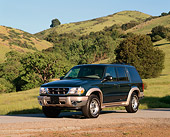 AUT 15 RK0316 01
2000 Ford Explorer Green And Gold 3/4 Front View Grass Hills And Trees