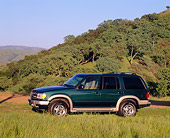 AUT 15 RK0317 06
2000 Ford Explorer Green And Gold 3/4 Front View On Grass Trees Background