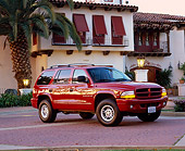 AUT 15 RK0323 02
2000 Dodge Durango Burgundy Side 3/4 View By Spanish Building At Dusk