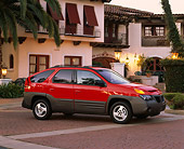 AUT 15 RK0406 05
2001 Pontiac Aztek GT 4-Door Red 3/4 Front View On Pavement By Spanish Building
