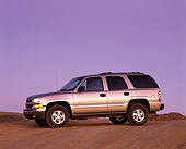 AUT 15 RK0419 02
2000 Chevrolet Tahoe 4WD Pewter 3/4 Side View On Pavement Hill At Dusk