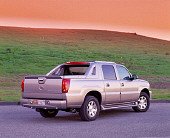AUT 15 RK0583 05
2002 Cadillac Escalade EXT Silver 3/4 Rear View On Pavement By Grass Hill Filtered