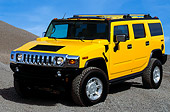 AUT 15 RK0617 02
2003 GM H2 Hummer Yellow 3/4 Front View On Pile Of Gravel Blue Sky