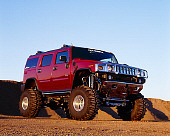 AUT 15 RK0645 01
2003 Hummer H2 Burgundy 3/4 Front View Low Angle On Dirt
