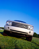 AUT 15 RK0749 01
2004 Land Rover Range Rover HSE Silver Head On View Low Angle On Grass Blue Sky