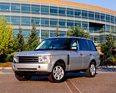 AUT 15 RK0750 01
2004 Land Rover Range Rover HSE Silver Front 3/4 View On Pavement By Building