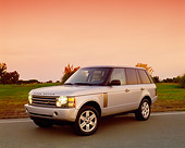 AUT 15 RK0755 02
2004 Land Rover Range Rover HSE Silver Front 3/4 View On Pavement By Grass Filtered
