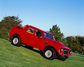 AUT 15 RK0757 03
1988 Lamborghini LM002 Red  3/4 Front View On Grass Hill