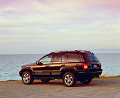 AUT 15 RK0776 02
2004 Jeep Cherokee Limited Burgundy 3/4 Rear View On Sand By Water Filtered