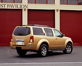 AUT 15 RK0791 01
2005 Nissan Pathfinder Gold Rear 3/4 View On Pavement By Garage Doors