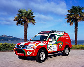 AUT 15 RK0795 01
Nissan Paladin Race Car 3/4 Front View On Pavement By Palm Trees