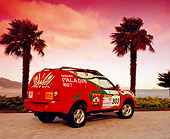 AUT 15 RK0798 05
Nissan Paladin Rally Car 3/4 Rear View On Pavement By Palm Trees