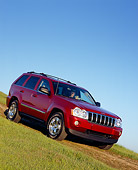 AUT 15 RK0858 01
2005 Jeep Grand Cherokee Limited 4WD Red 3/4 Front View On Grass Blue Sky