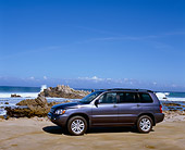 AUT 15 RK0882 02
2006 Toyota Highlander Hybrid Blue 3/4 Front View On Sand By Ocean