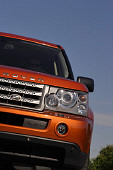 AUT 15 RK0907 01
2006 Land Rover Range Rover Supercharged Orange Partial Head On Shot