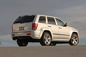AUT 15 RK0936 01
2006 Jeep Grand Cherokee SRT8 Silver Low 3/4 Rear View On Pavement